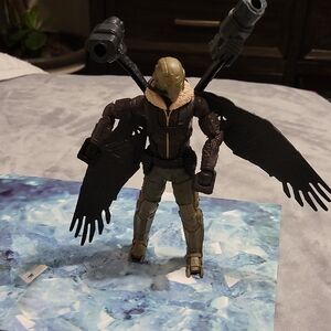 Action Figure with Wings and Weapons